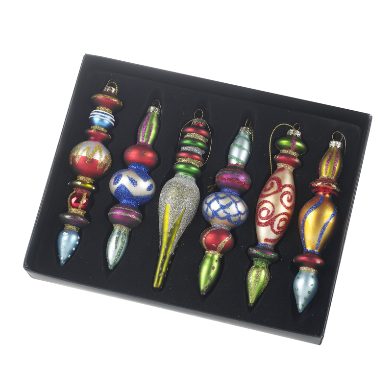 Multi Coloured Glass Ornament Christmas Bauble Set by Heaven Sends<br><br> Make your Christmas tree burst with personality using this vibrant Multi Coloured Glass Ornament Christmas Bauble Set by Heaven Sends. This playful collection of six statement baubles brings together an exciting mix of shapes textures and rainbow-bright colours to create a fun festive look that feels both nostalgic and joyfully eclectic.<br><br> Each hand-painted glass ornament features its own unique silhouette - from stacked spheres and elegant double-drops to slender icicle finials - ensuring your tree catches the eye from every angle. The bold colour palette mixes cherry reds sapphire blues emerald greens shimmering golds silvers and candy pinks all accented with glitter highlights and hand-applied decorative details that pop against twinkling fairy lights.<br><br> Each hand-painted glass ornament features its own unique silhouette - from stacked spheres and elegant double-drops to slender icicle finials - ensuring your tree catches the eye from every angle. The bold colour palette mixes cherry reds sapphire blues emerald greens shimmering golds silvers and candy pinks all accented with glitter highlights and hand-applied decorative details that pop against twinkling fairy lights.<br><br> Presented in a smart black gift box this set is perfect for anyone who loves a maximalist colourful Christmas or wants to add a playful focal point to a more traditional scheme. Mix them throughout your tree cluster them as a mantel arrangement or gift the entire boxed set to the friend who never shies away from festive fun.